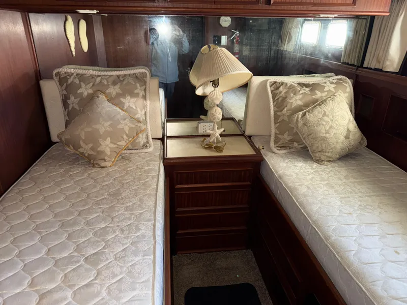Slide: The Image of Interior of 1980 Hatteras 58MY yacht with twin beds and elegant decor. - 17