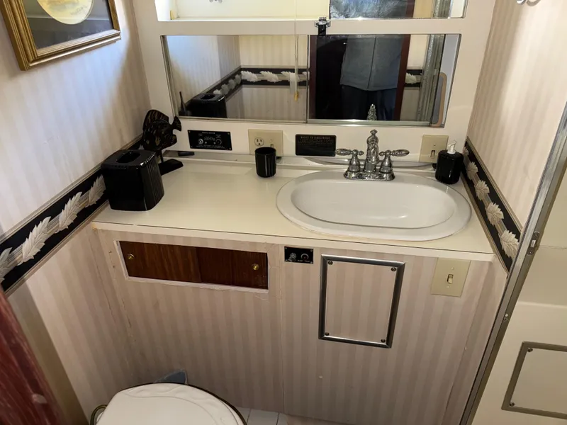 Slide: The Image of Bathroom interior of 1980 Hatteras 58MY yacht with sink and mirror. - 18