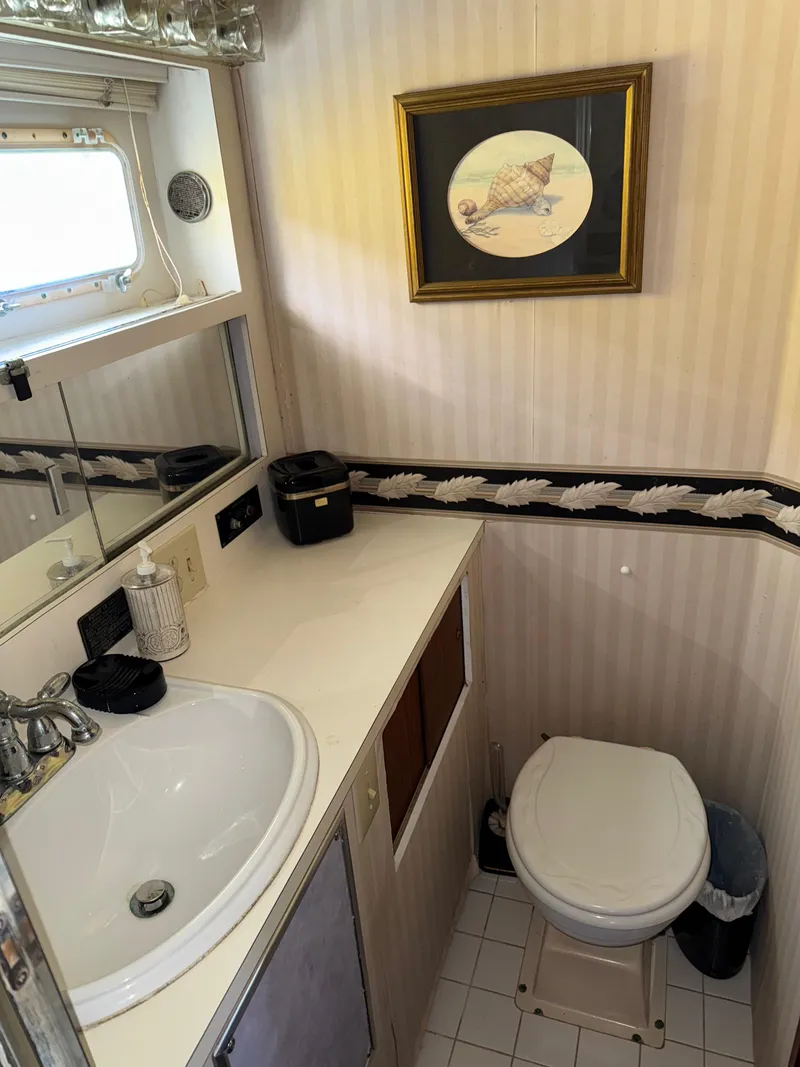 Slide: The Image of Bathroom interior of 1980 Hatteras 58MY yacht with sink and toilet. - 19