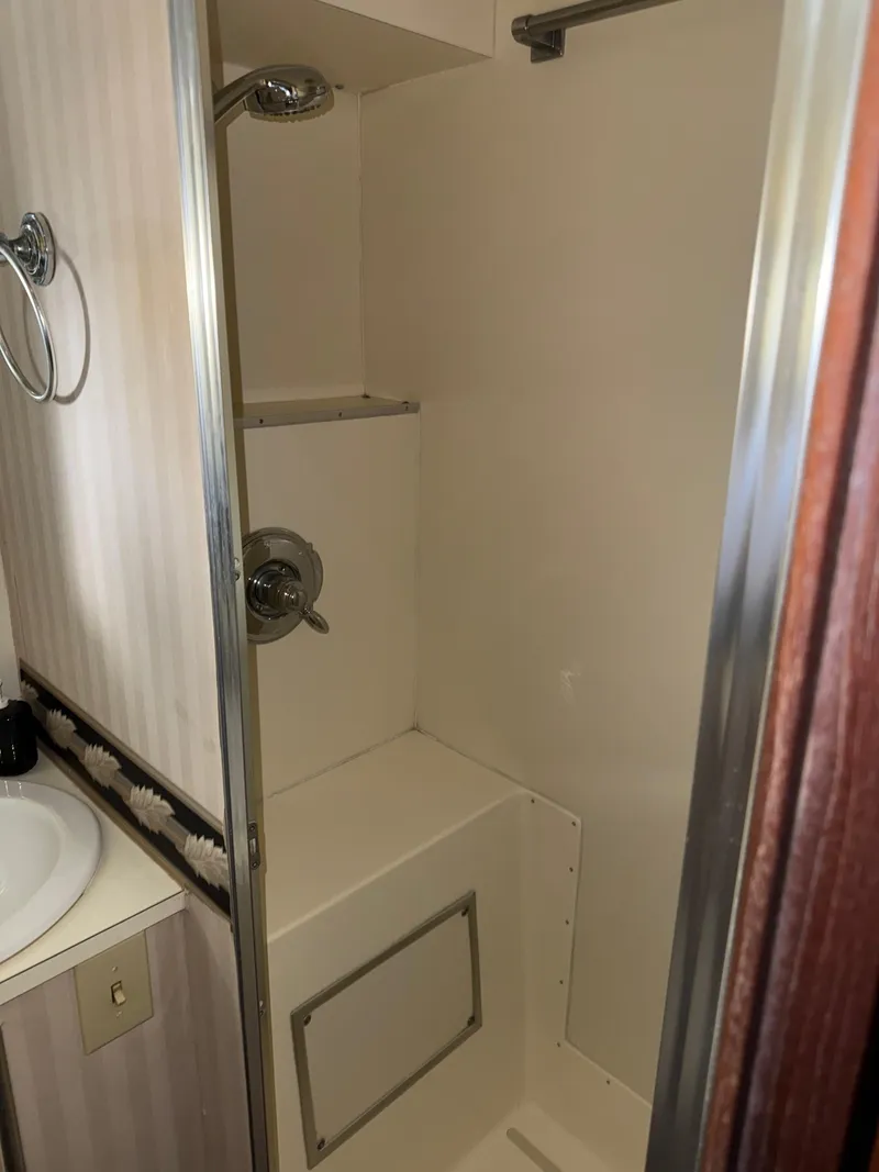 Slide: The Image of 1980 Hatteras 58MY yacht bathroom with shower and sink. - 23