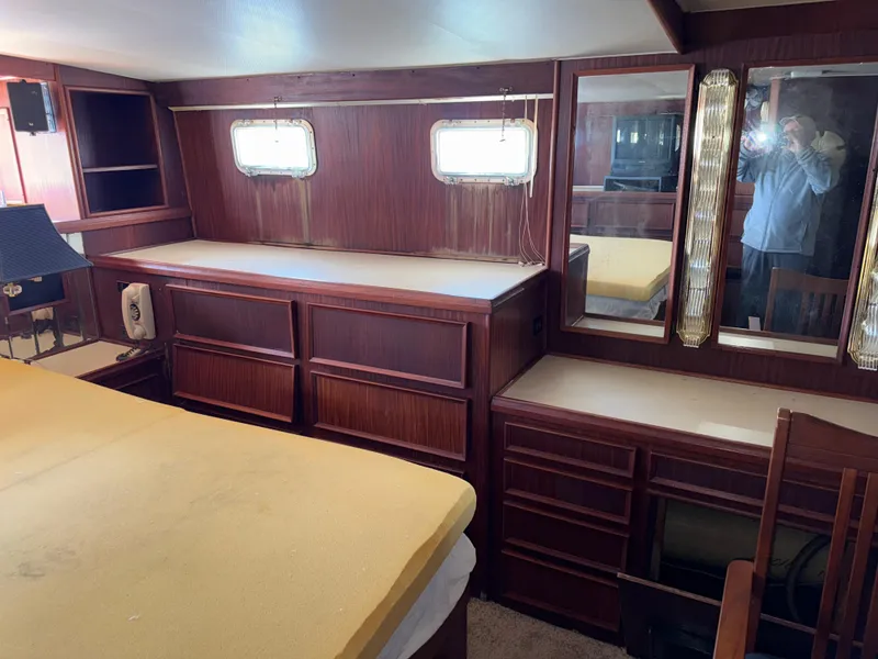 Slide: The Image of Interior of 1980 Hatteras 58MY yacht with wood cabinetry and windows. - 26