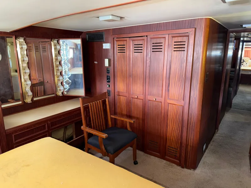 Slide: The Image of Interior of 1980 Hatteras 58MY yacht with wooden cabinetry and seating area. - 27