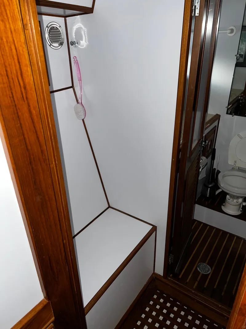 Slide: The Image of Compact bathroom with wooden accents in a 1990 Nova 4500 model. - 17