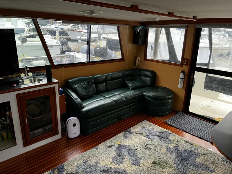 Slide: The Image of Interior of a 1990 Nova 4500 boat with leather seating and kitchenette. - 8