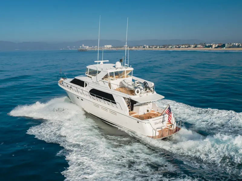 Slide: The Image of 2003 Ocean Alexander 64 Pilothouse yacht cruising on open water. - 17