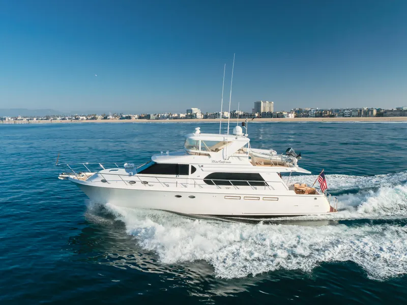 Slide: The Image of 2003 Ocean Alexander 64 Pilothouse yacht cruising on open water. - 18