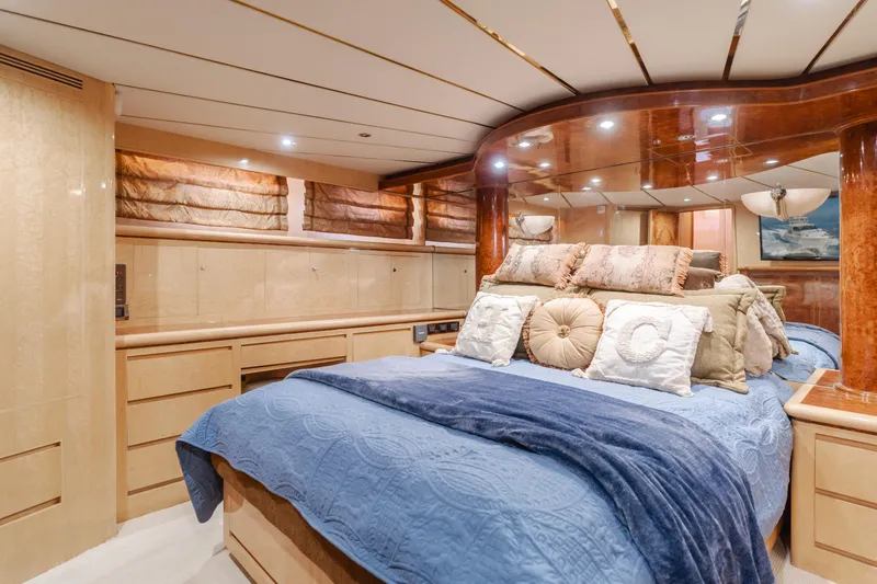 Slide: The Image of Luxurious bedroom interior of 2003 Ocean Alexander 64 Pilothouse yacht with elegant bedding. - 20