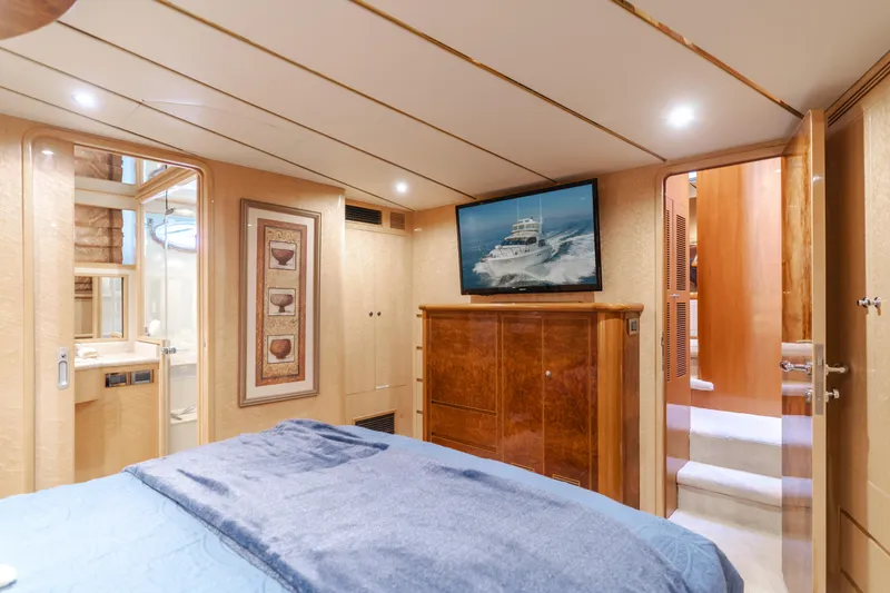 Slide: The Image of Luxurious bedroom interior of 2003 Ocean Alexander 64 Pilothouse yacht with modern amenities. - 21