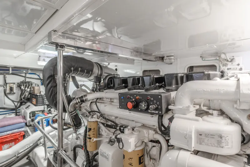 Slide: The Image of Engine room of 2003 Ocean Alexander 64 Pilothouse yacht, showcasing detailed machinery. - 31