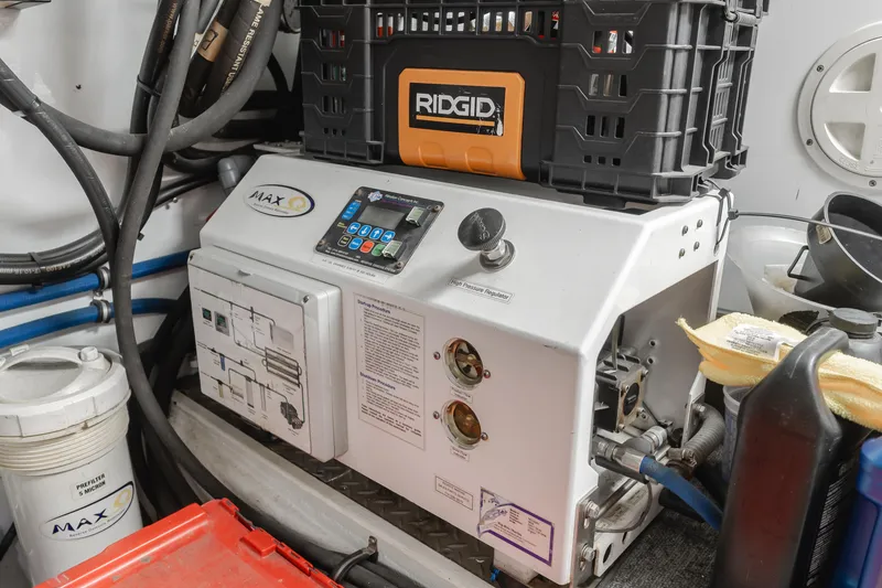 Slide: The Image of Engine room of 2003 Ocean Alexander 64 Pilothouse with equipment and storage. - 33