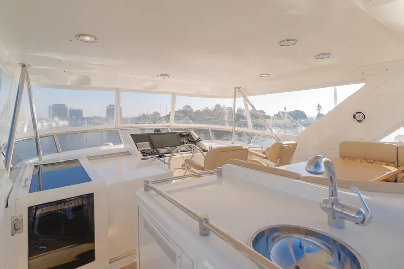 Slide: The Image of 2003 Ocean Alexander 64 Pilothouse yacht interior with helm and seating area. - 36