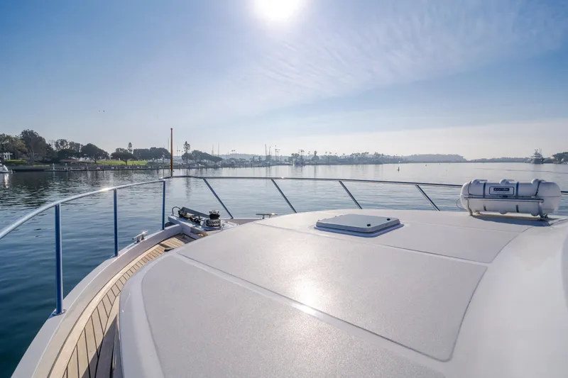 Slide: The Image of Ocean Alexander 64 Pilothouse 2003 yacht deck with scenic waterfront view. - 46