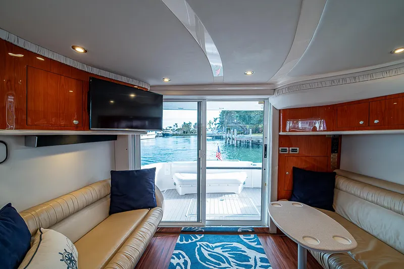 Slide: The Image of Interior of 2001 Sea Ray 400 Sedan Bridge yacht with elegant seating and waterfront view. - 22