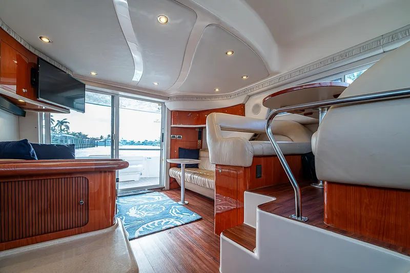 Slide: The Image of Interior of 2001 Sea Ray 400 Sedan Bridge yacht, featuring luxurious seating and modern design. - 25