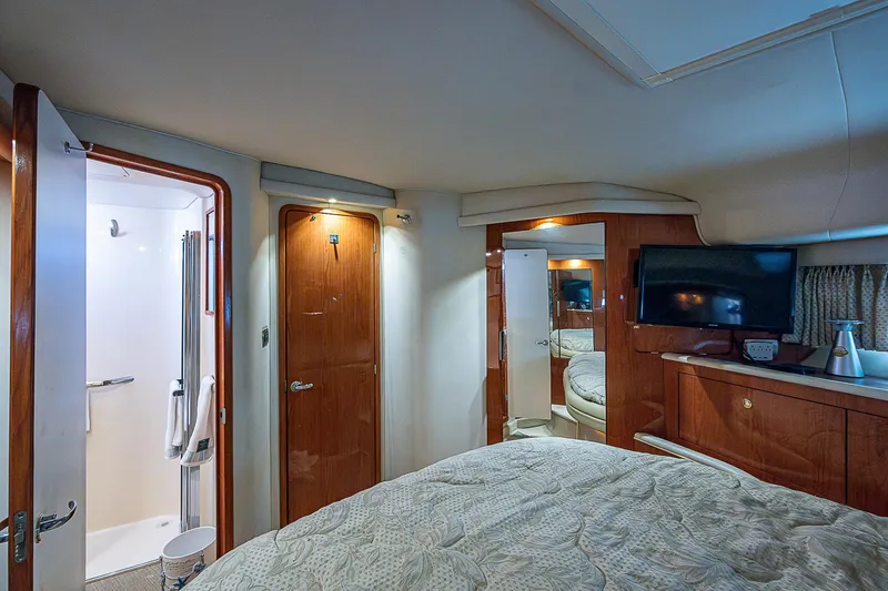 Slide: The Image of Interior of 2001 Sea Ray 400 Sedan Bridge yacht bedroom with ensuite bathroom. - 34