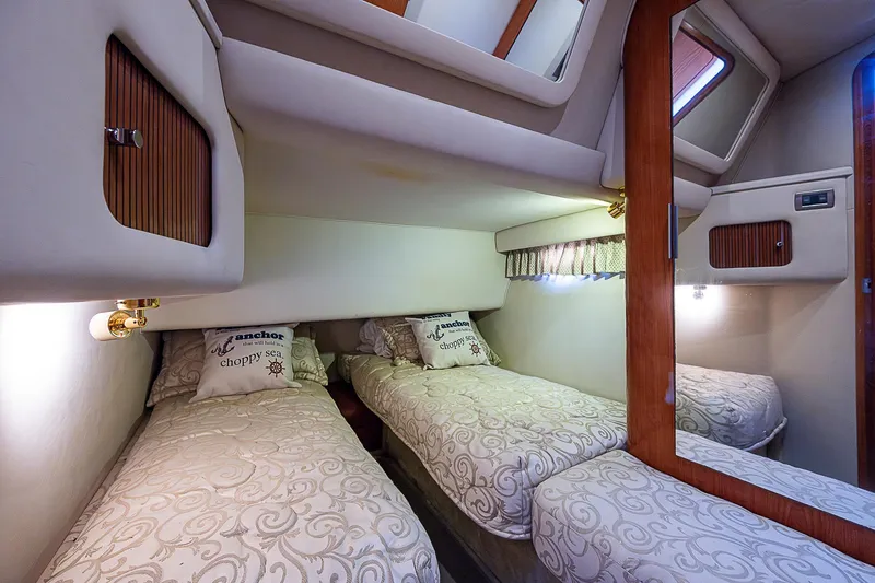 Slide: The Image of Interior cabin of 2001 Sea Ray 400 Sedan Bridge with twin beds and elegant decor. - 39