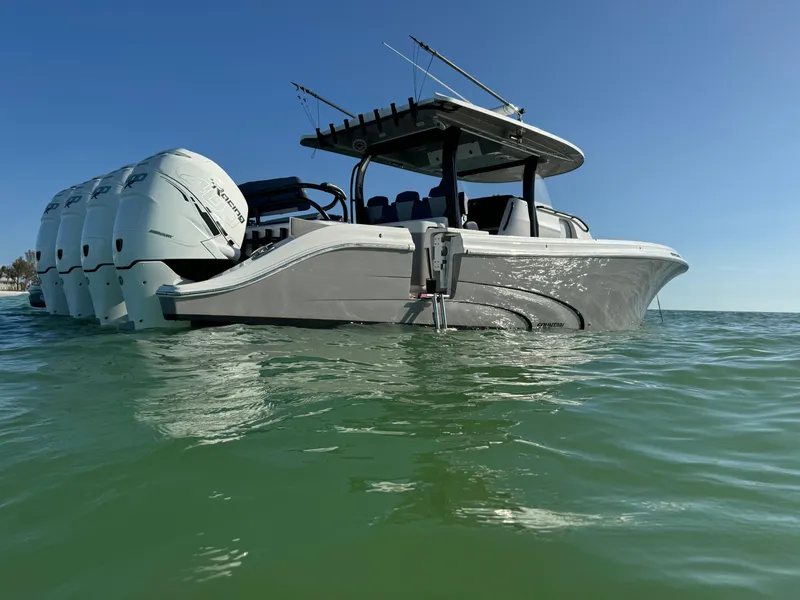 Slide: The Image of 2019 Fountain 43NX boat on water, featuring multiple outboard engines. - 1