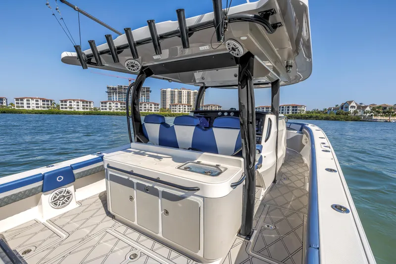 Slide: The Image of 2019 Fountain 43NX boat with sleek design, spacious deck, and modern amenities on the water. - 14