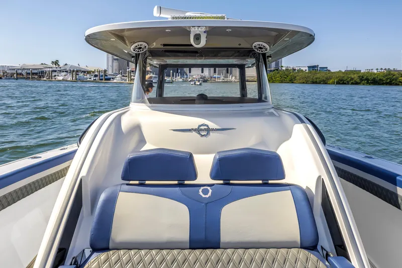 Slide: The Image of 2019 Fountain 43NX boat on water, showcasing sleek design and luxury seating. - 18
