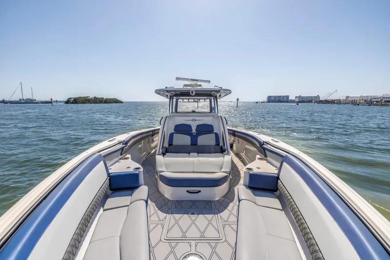 Slide: The Image of 2019 Fountain 43NX boat interior with luxurious seating on open water. - 19