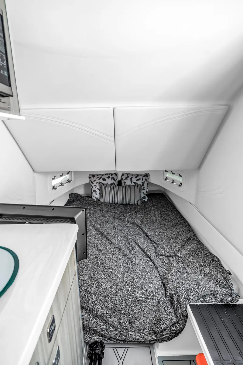 Slide: The Image of 2019 Fountain 43NX cabin interior with cozy bed and modern design. - 21