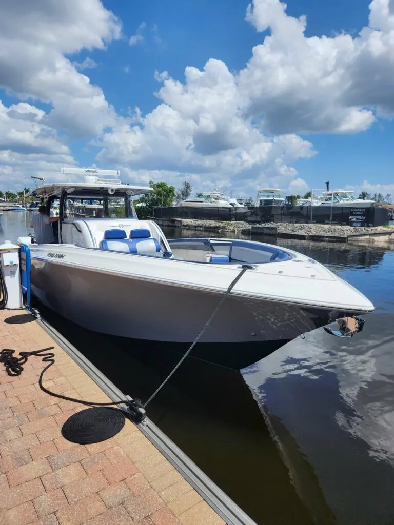 Slide: The Image of 2019 Fountain 43NX boat docked on a sunny day with blue skies. - 27