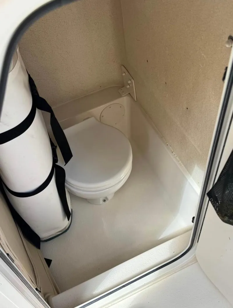 Slide: The Image of 2024 Sea Chaser 24 HFC boat interior with compact marine toilet. - 23