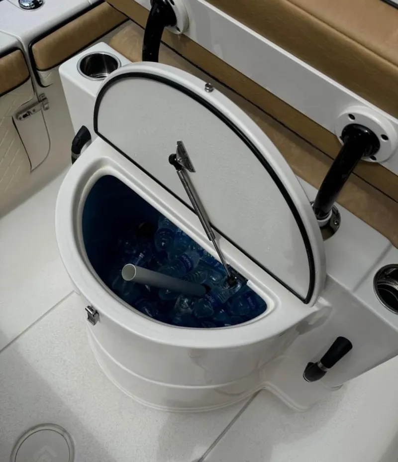 Slide: The Image of 2024 Sea Chaser 24 HFC boat with open cooler filled with ice and drinks. - 30