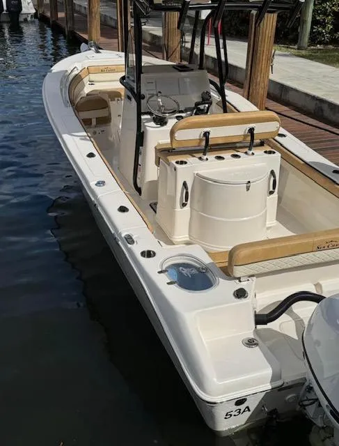 Slide: The Image of 2024 Sea Chaser 24 HFC boat docked, featuring spacious deck and modern design. - 8