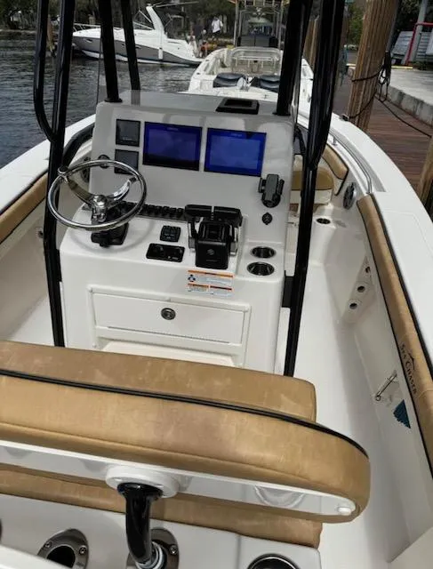 Slide: The Image of 2024 Sea Chaser 24 HFC boat interior with modern navigation equipment and seating. - 9