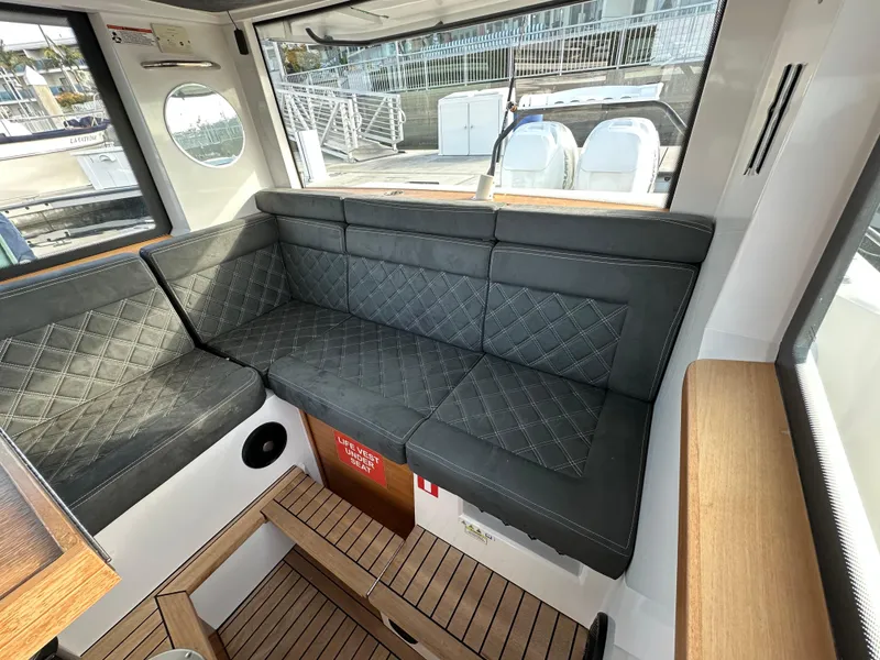 Slide: The Image of Interior seating of 2017 Axopar 37 boat with quilted upholstery. - 18