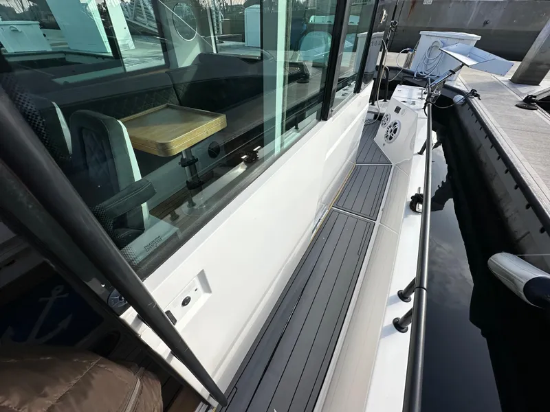 Slide: The Image of Axopar 37 boat, 2017 model, side view with seating and docked at marina. - 19