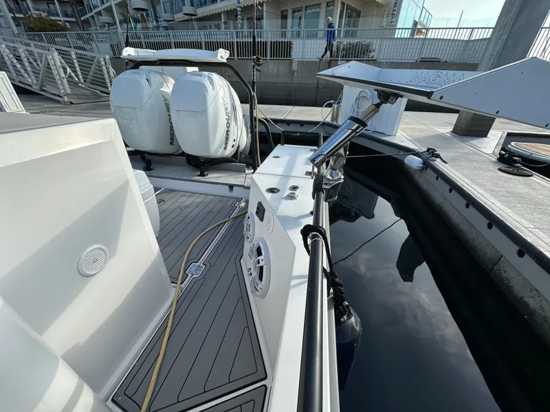 Slide: The Image of 2017 Axopar 37 boat docked, featuring dual outboard engines and sleek deck design. - 24