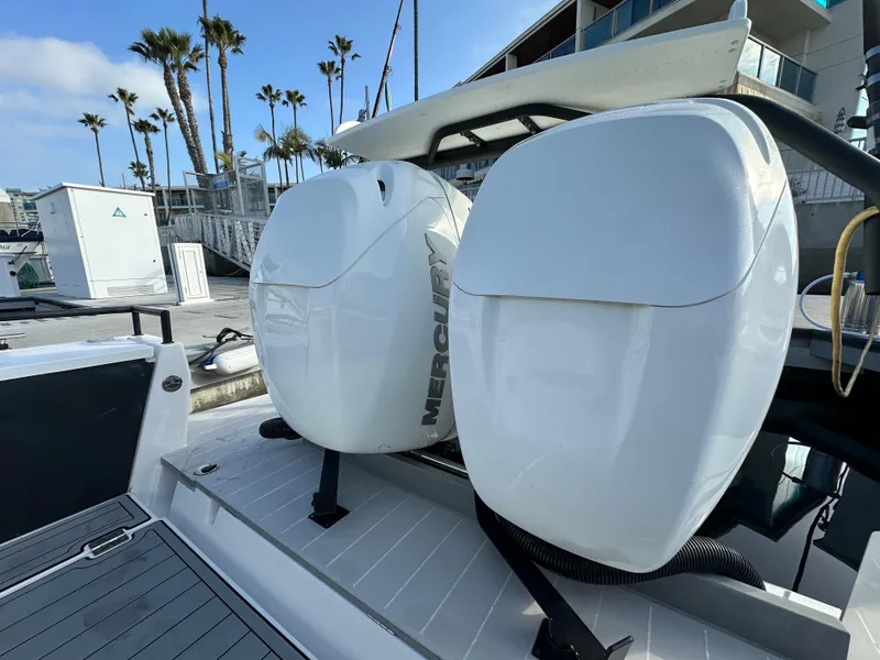 Slide: The Image of 2017 Axopar 37 boat with dual Mercury outboard engines at a marina. - 25