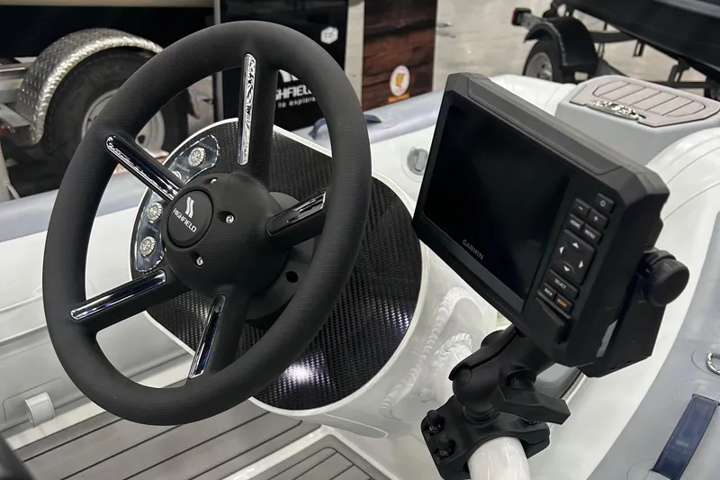 Slide: The Image of 2024 Highfield Classic 310 FCT steering wheel and navigation display. - 4