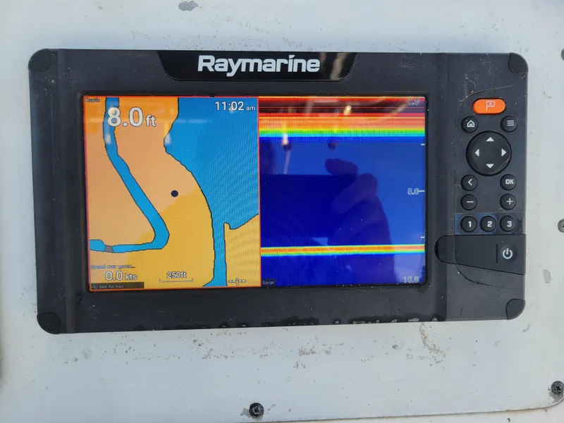 Slide: The Image of Raymarine navigation display on a 2001 Century 2300 Center Console boat, showing depth and sonar. - 7