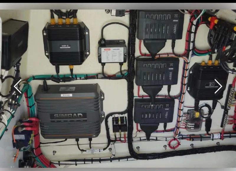 Slide: The Image of Electrical system setup in a 2018 Yellowfin 36 boat, featuring Simrad equipment and organized wiring. - 14