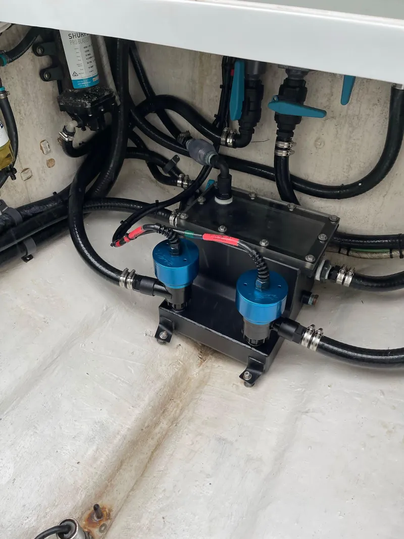 Slide: The Image of 2018 Yellowfin 36 boat engine compartment with wiring and components. - 19