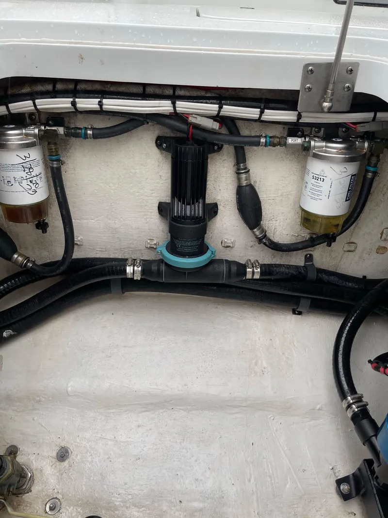 Slide: The Image of Engine compartment of a 2018 Yellowfin 36 boat, showing fuel filters and hoses. - 20