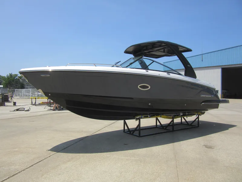 The Image of 2025 Chaparral 307 SSX boat displayed outdoors on a stand. - 0