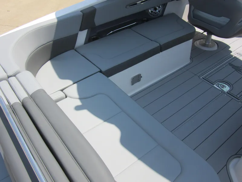 Slide: The Image of 2025 Chaparral 307 SSX boat interior with gray seating and sleek design. - 13