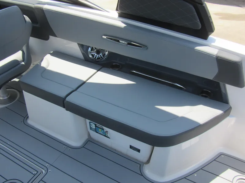 Slide: The Image of 2025 Chaparral 307 SSX boat interior seating with sleek gray upholstery and modern design. - 14