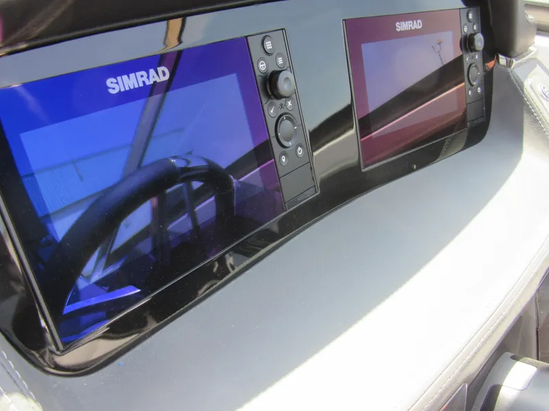 Slide: The Image of Dashboard of 2025 Chaparral 307 SSX with dual Simrad displays. - 17