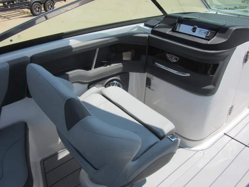 Slide: The Image of 2025 Chaparral 307 SSX boat interior with modern helm and seating. - 18