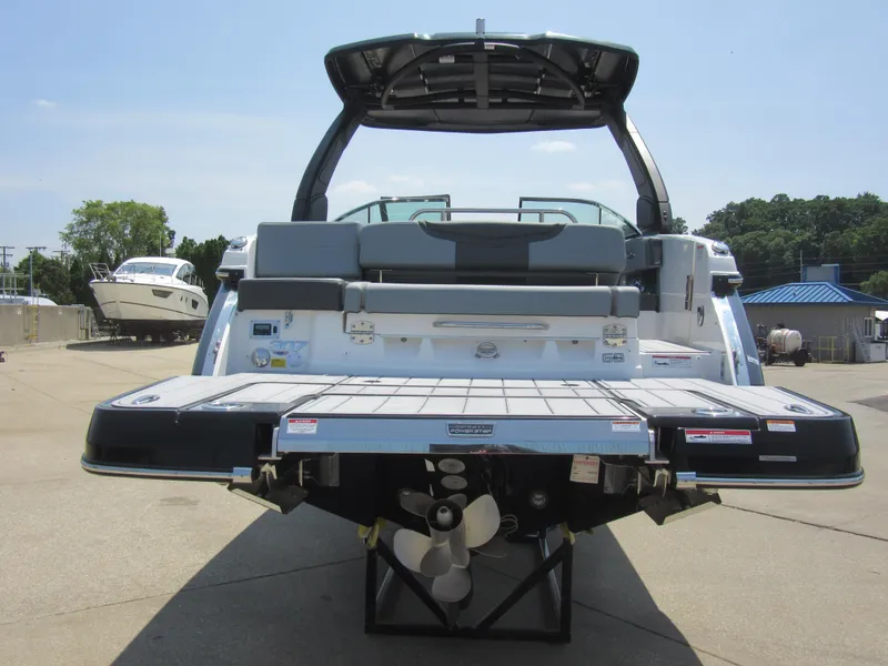 Slide: The Image of 2025 Chaparral 307 SSX boat rear view with swim platform and propeller. - 5