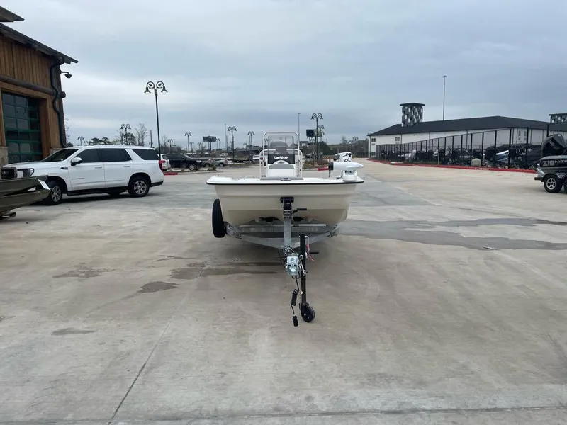 Slide: The Image of 2025 Mako Pro Skiff 17 CC on trailer in parking lot. - 2