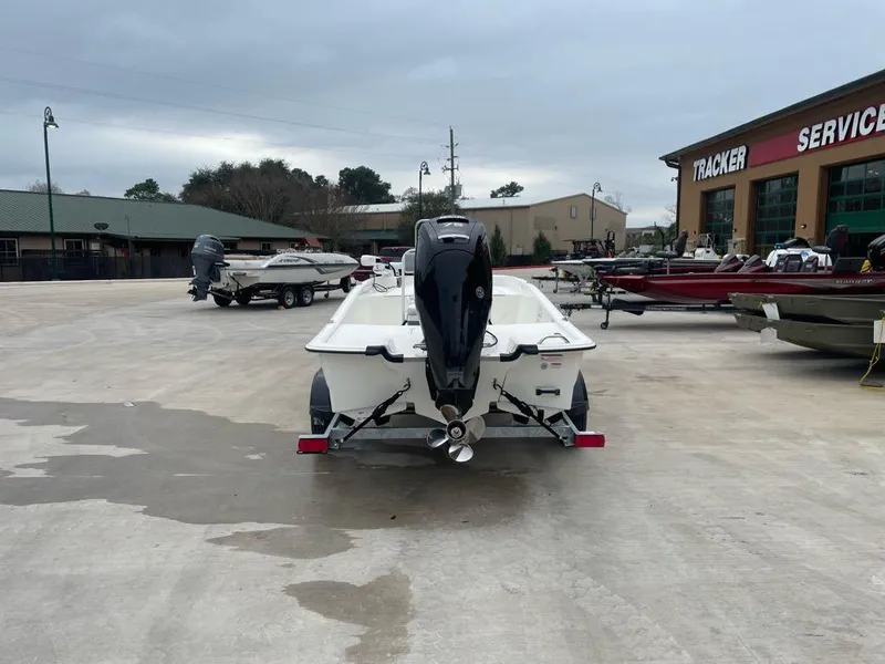 Slide: The Image of 2025 Mako Pro Skiff 17 CC boat on trailer at dealership lot. - 3