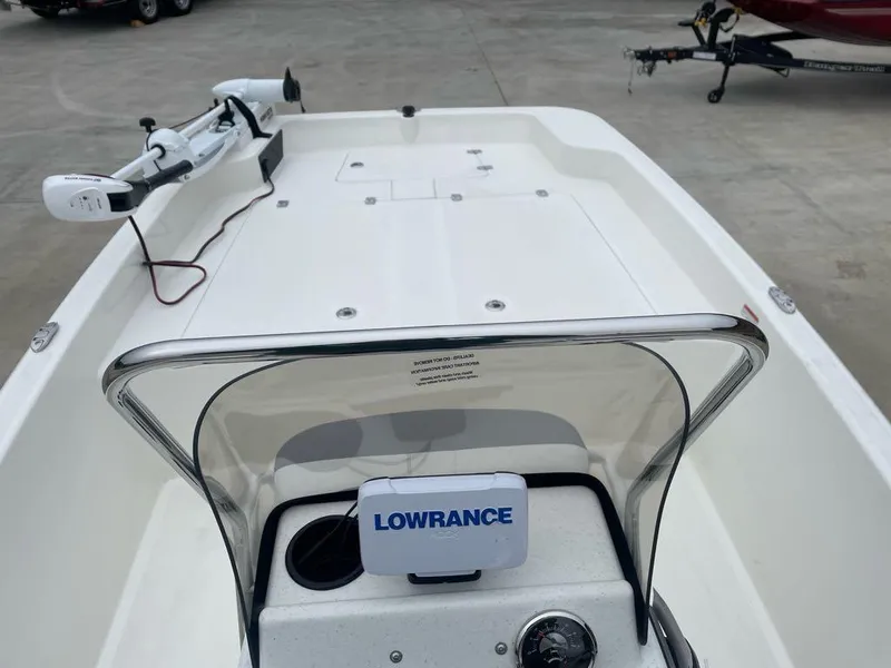 Slide: The Image of 2025 Mako Pro Skiff 17 CC boat with Lowrance navigation system and trolling motor. - 4