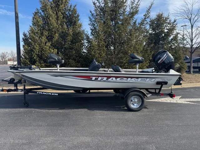 The Image of 2025 Tracker Pro Team 175 Crappie Edition boat on trailer, parked outdoors. - 0