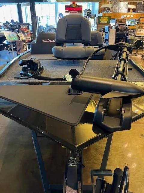 Slide: The Image of 2025 Tracker Bass Tracker Classic XL boat interior with fishing equipment. - 2